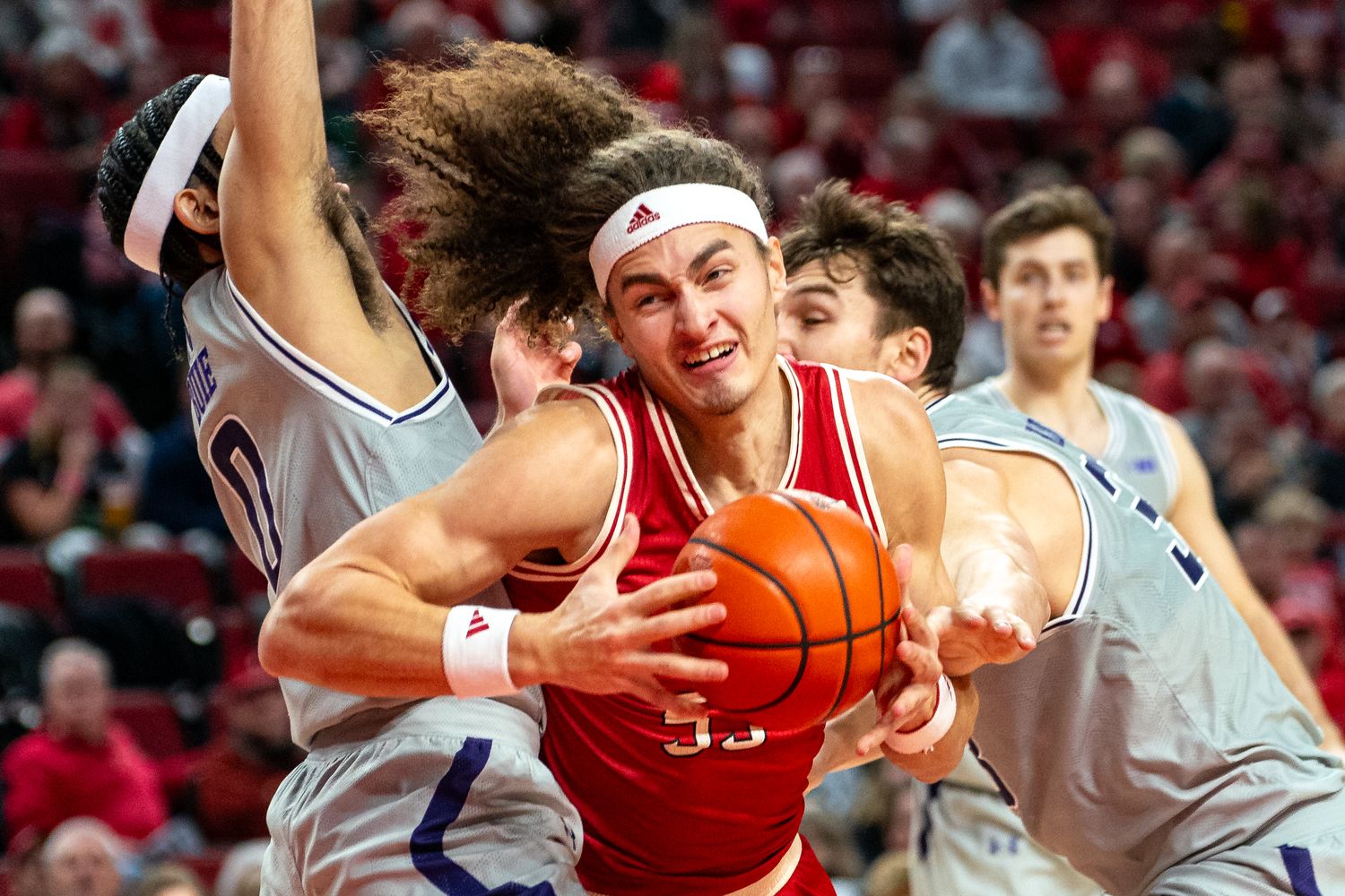 Jan 20, 2024; Lincoln, Nebraska, USA; Nebraska Cornhuskers forward Josiah Allick (53) drives against Northwestern Wildcats guard Boo Buie (0) and forward Luke Hunger (33) during the first half at Pinnacle Bank Arena.